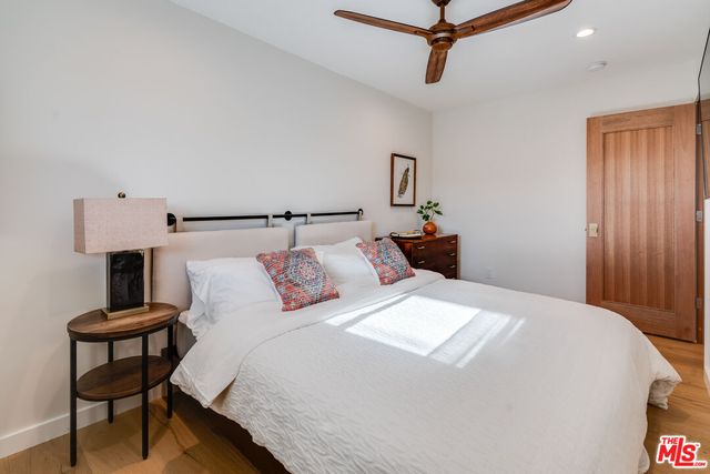 a bedroom with a bed and a table in it