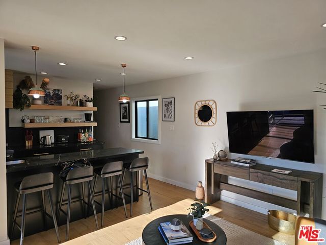 a view of kitchen with furniture and wooden floor