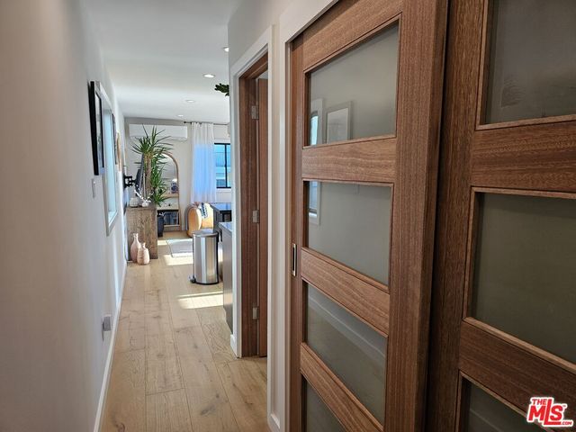 a view of a hallway with living room and chair