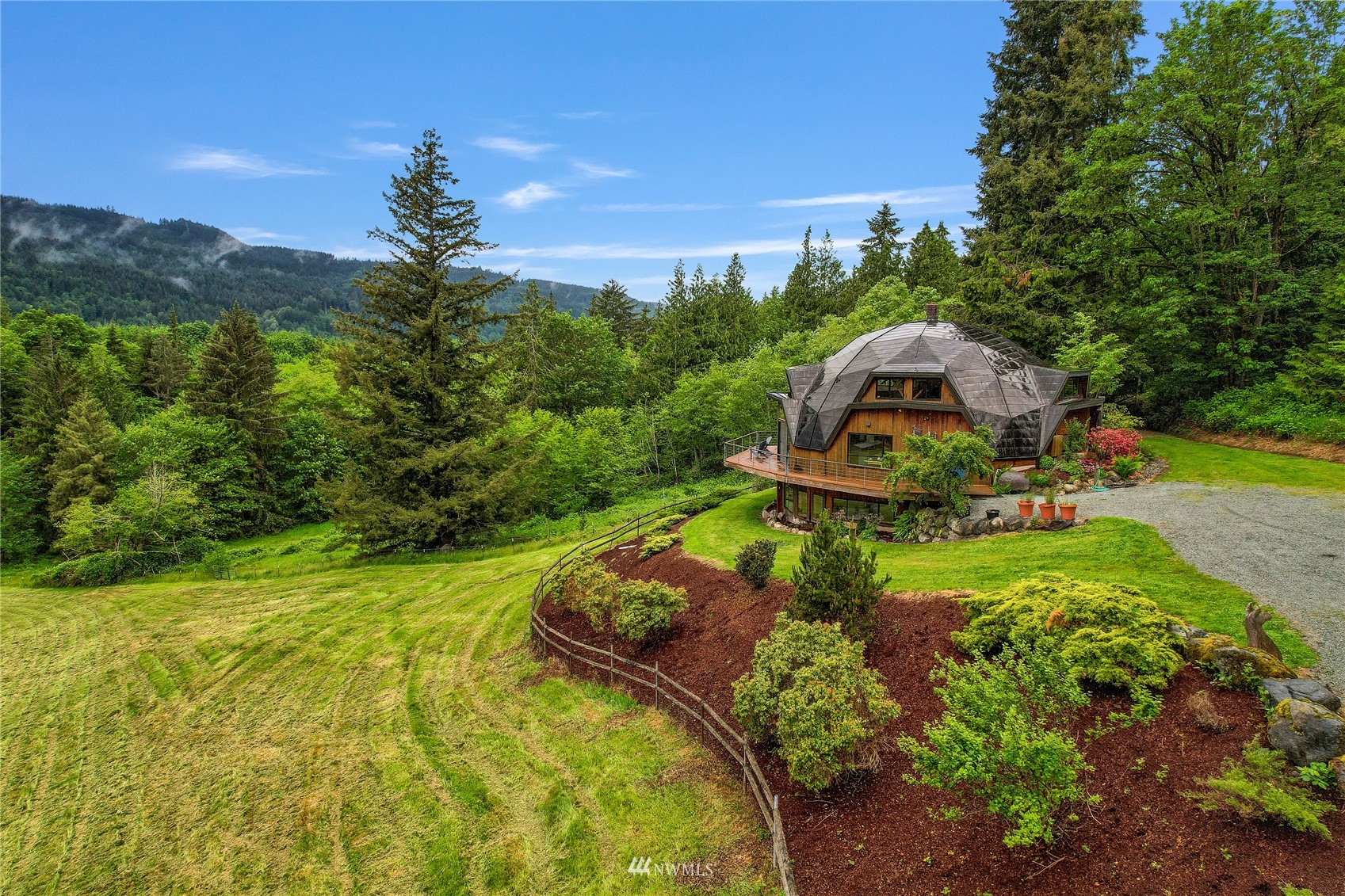 a view of a garden with lawn chairs