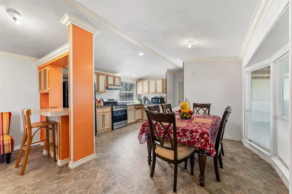 a living room with furniture a ceiling fan and a rug