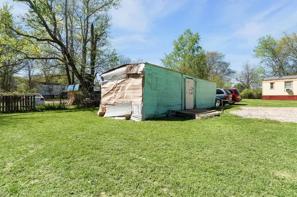 a room with a bed and a dresser