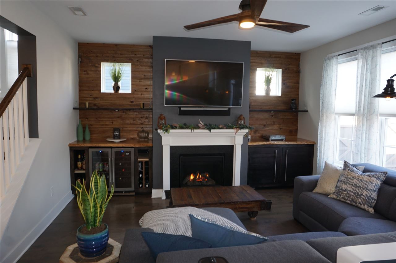 1720 Chestnut Falls Road Wendell, NC 27591 - Photo 9 of 30 New built-ins with wine chiller (nego). Gas logs. Family room