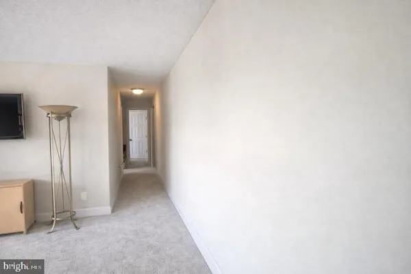 a view of a hallway with closet