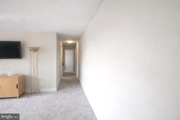 a view of a livingroom with wooden floor