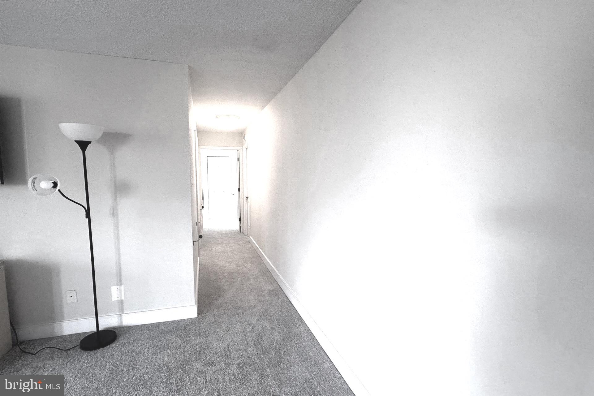 1220 Blair Mill Road, Unit 405 Silver Spring, MD 20910 - Photo 12 of 39 a view of a hallway with wooden floor