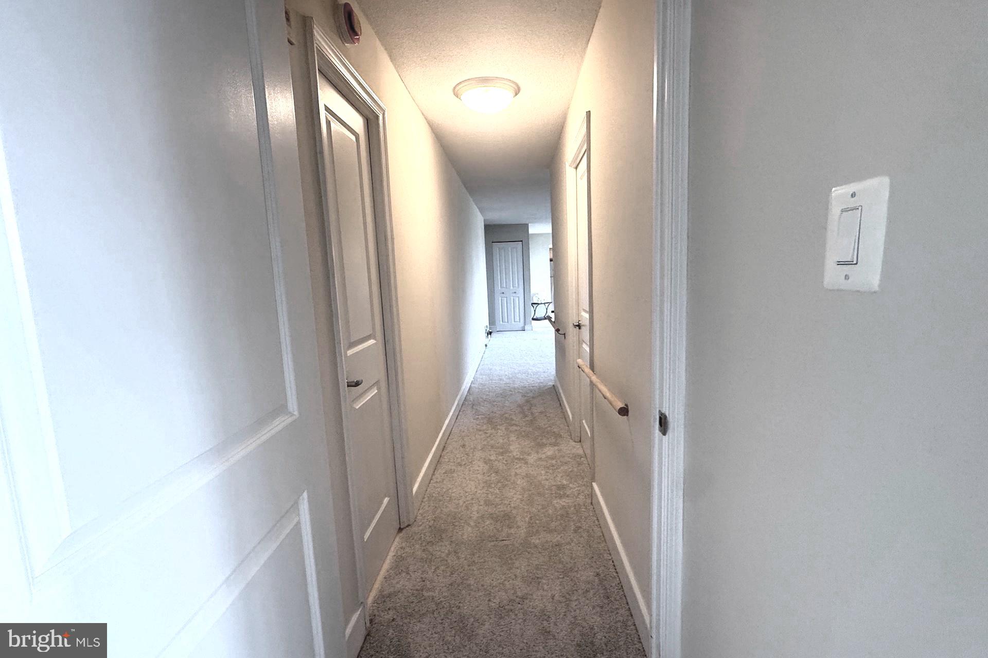 1220 Blair Mill Road, Unit 405 Silver Spring, MD 20910 - Photo 13 of 39 a view of a hallway with wooden floor