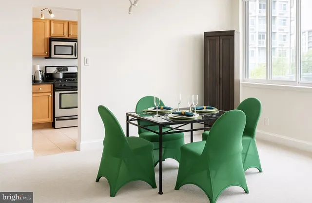 a view of a dining room with furniture window and outside view