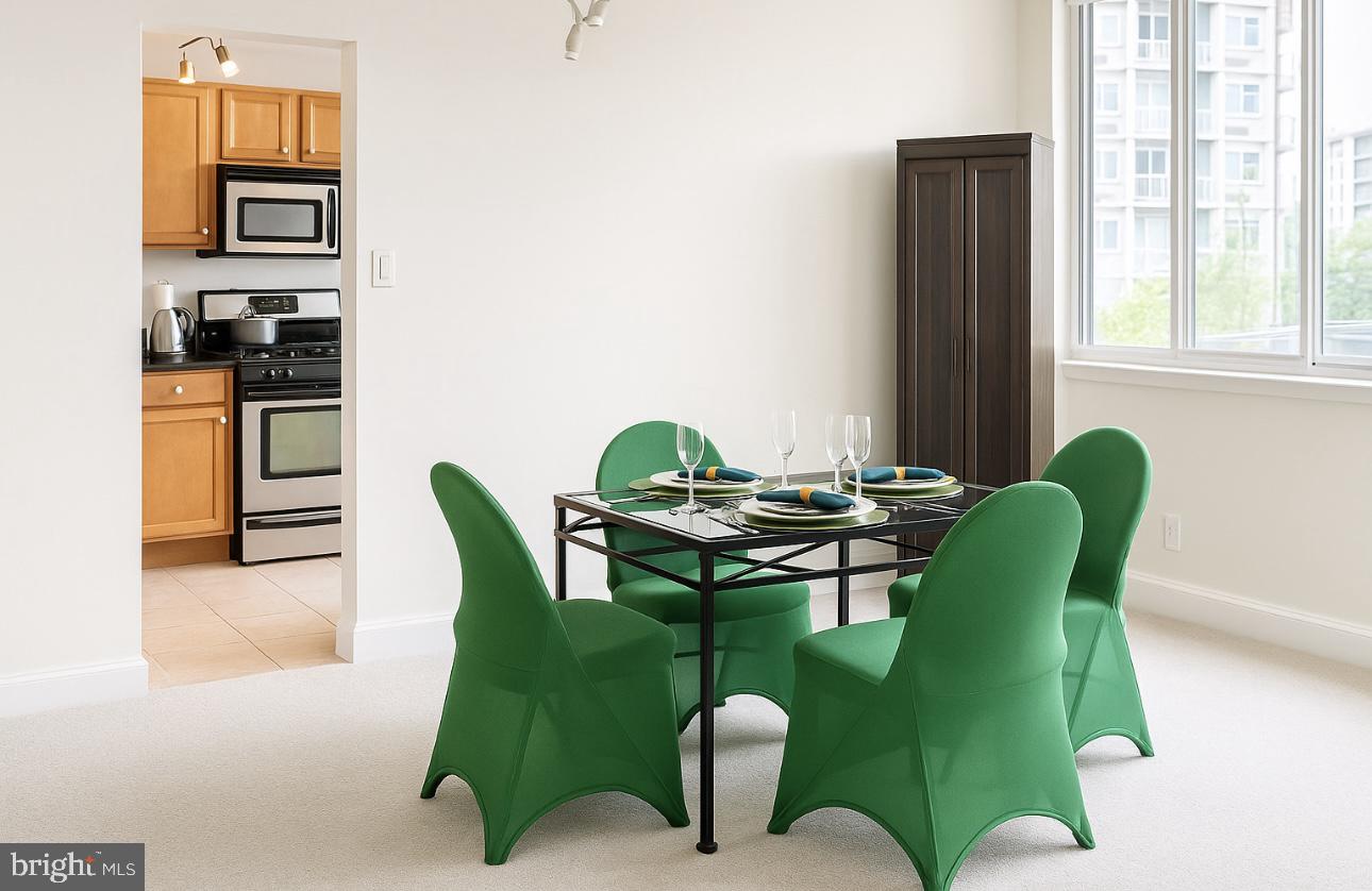 1220 Blair Mill Road, Unit 405 Silver Spring, MD 20910 - Photo 17 of 39 a view of a dining room with furniture window and outside view