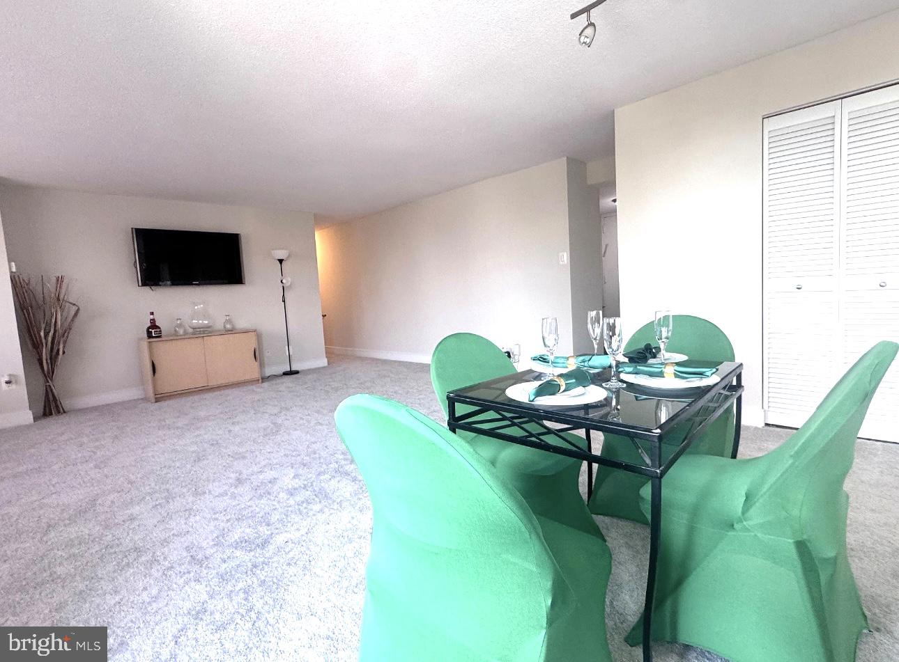 1220 Blair Mill Road, Unit 405 Silver Spring, MD 20910 - Photo 20 of 39 a living room with furniture and a flat screen tv