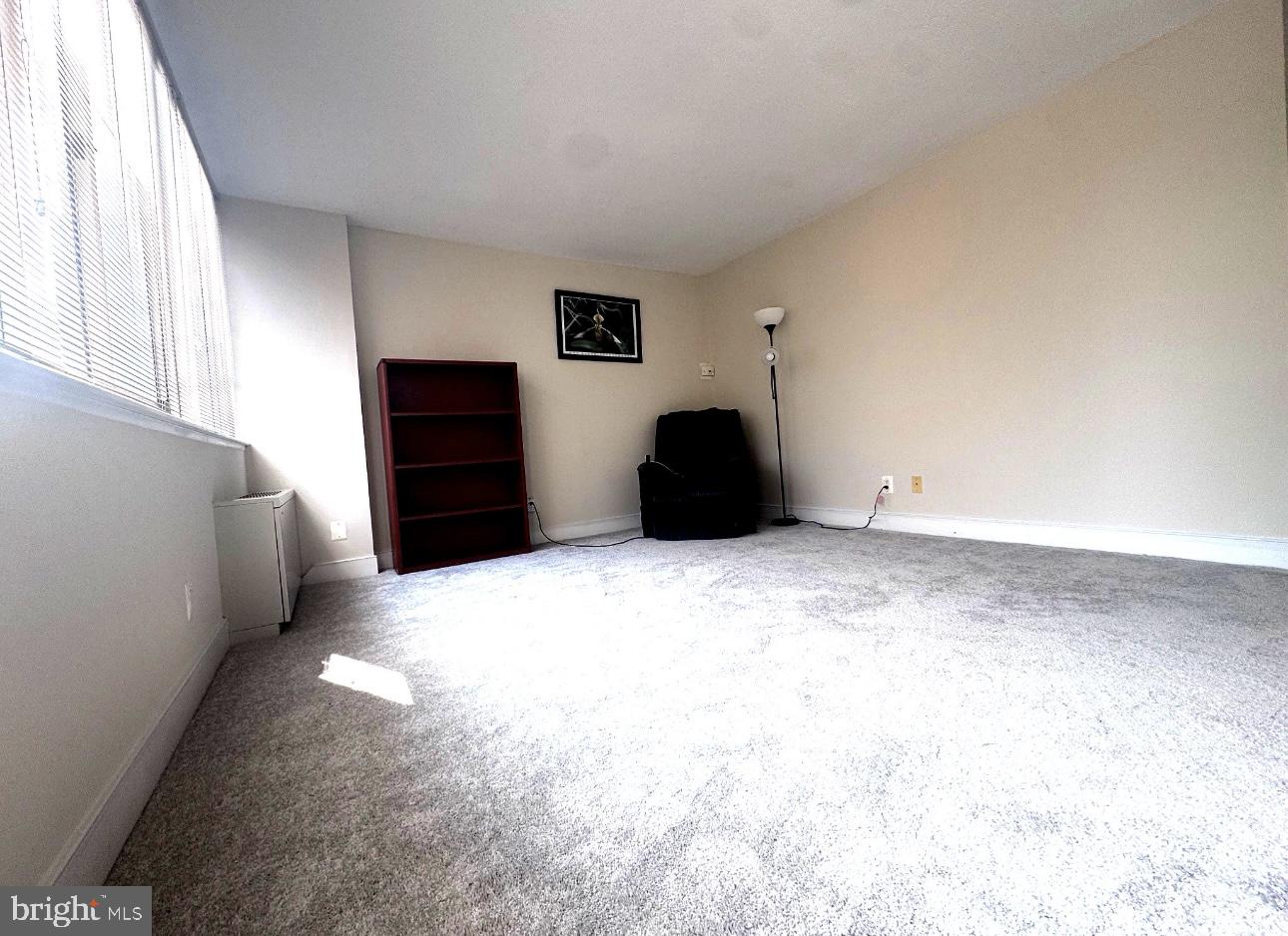 1220 Blair Mill Road, Unit 405 Silver Spring, MD 20910 - Photo 25 of 39 a view of an empty room with a window