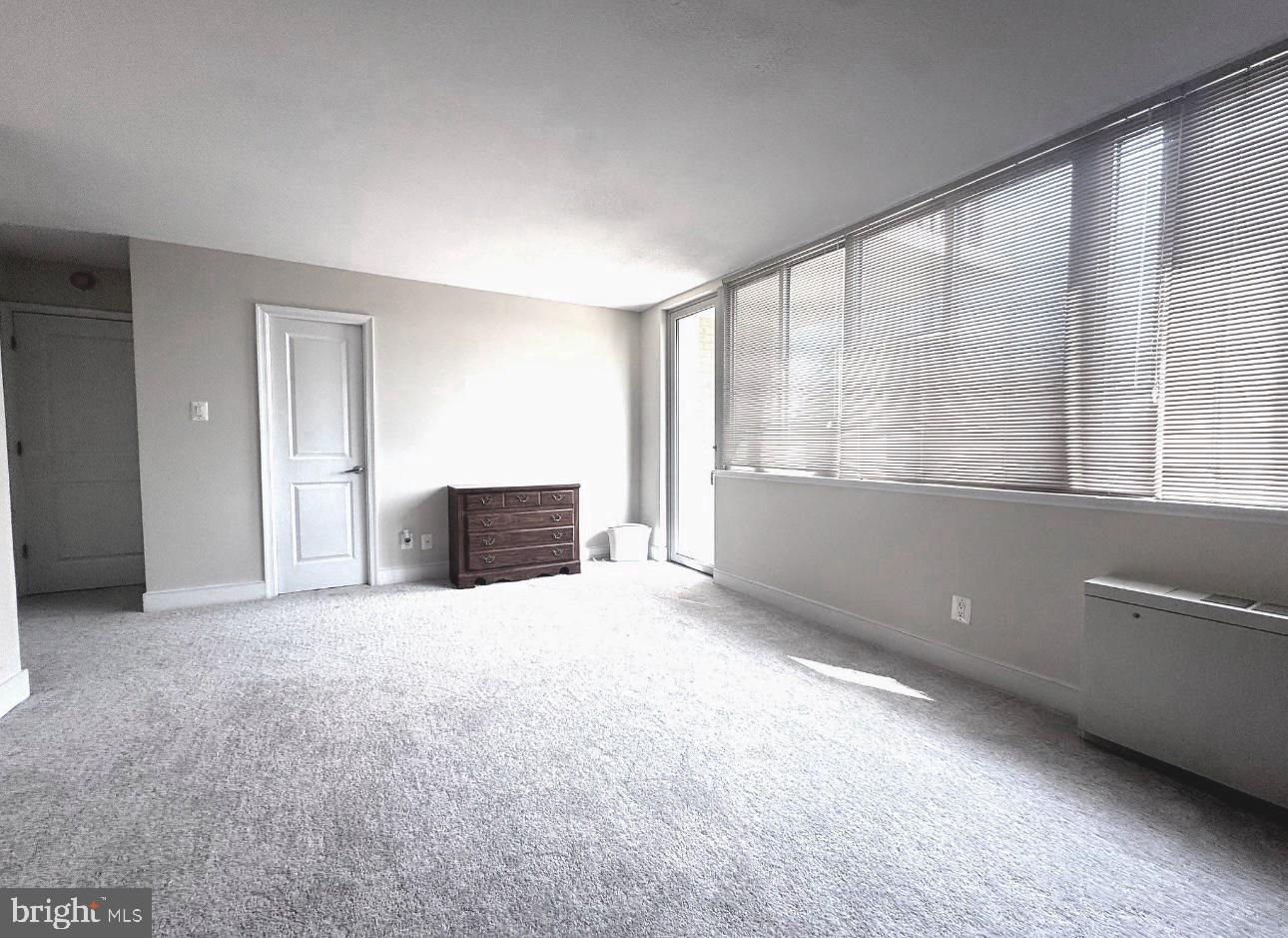 1220 Blair Mill Road, Unit 405 Silver Spring, MD 20910 - Photo 27 of 39 a view of an empty room with a window