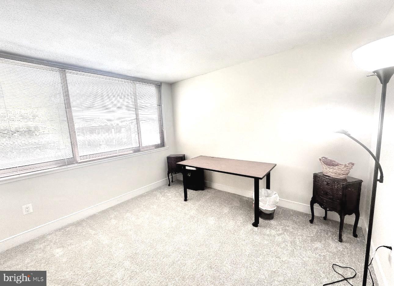 1220 Blair Mill Road, Unit 405 Silver Spring, MD 20910 - Photo 28 of 39 a bedroom with furniture and a window