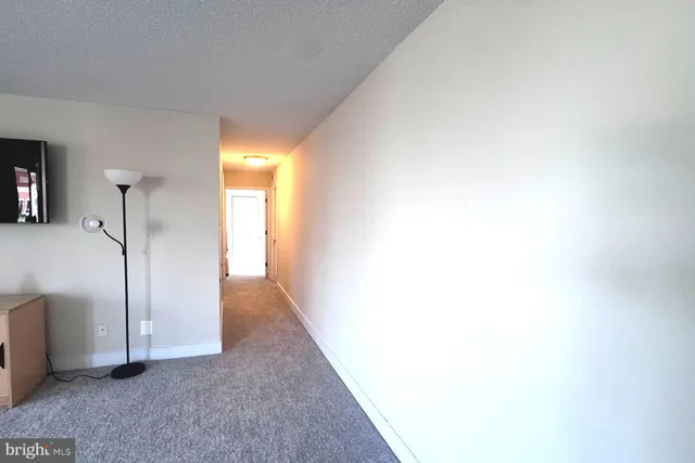 a view of a hallway with a white walls