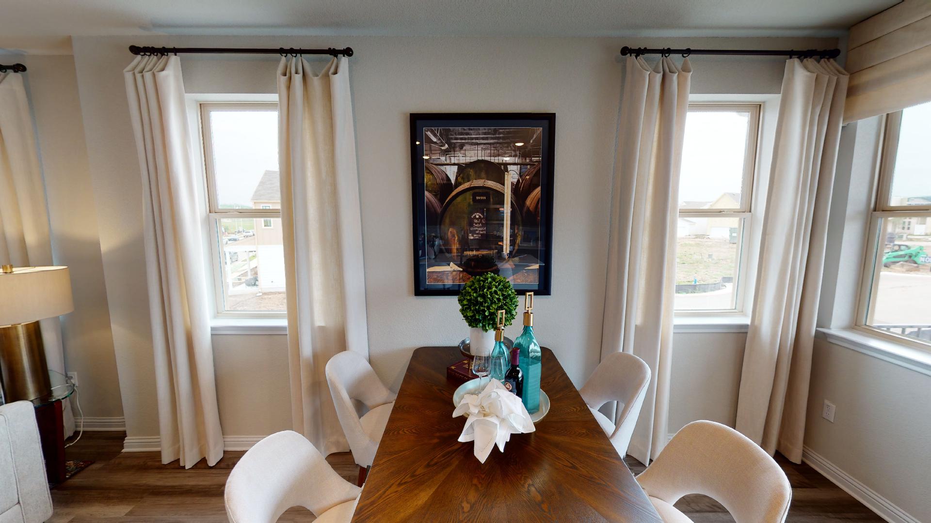 8111 Springsteen Drive Austin, TX 78744 - Photo 3 of 11 Representative Image - Dining area featuring dark wood-type flooring and plenty of natural light
