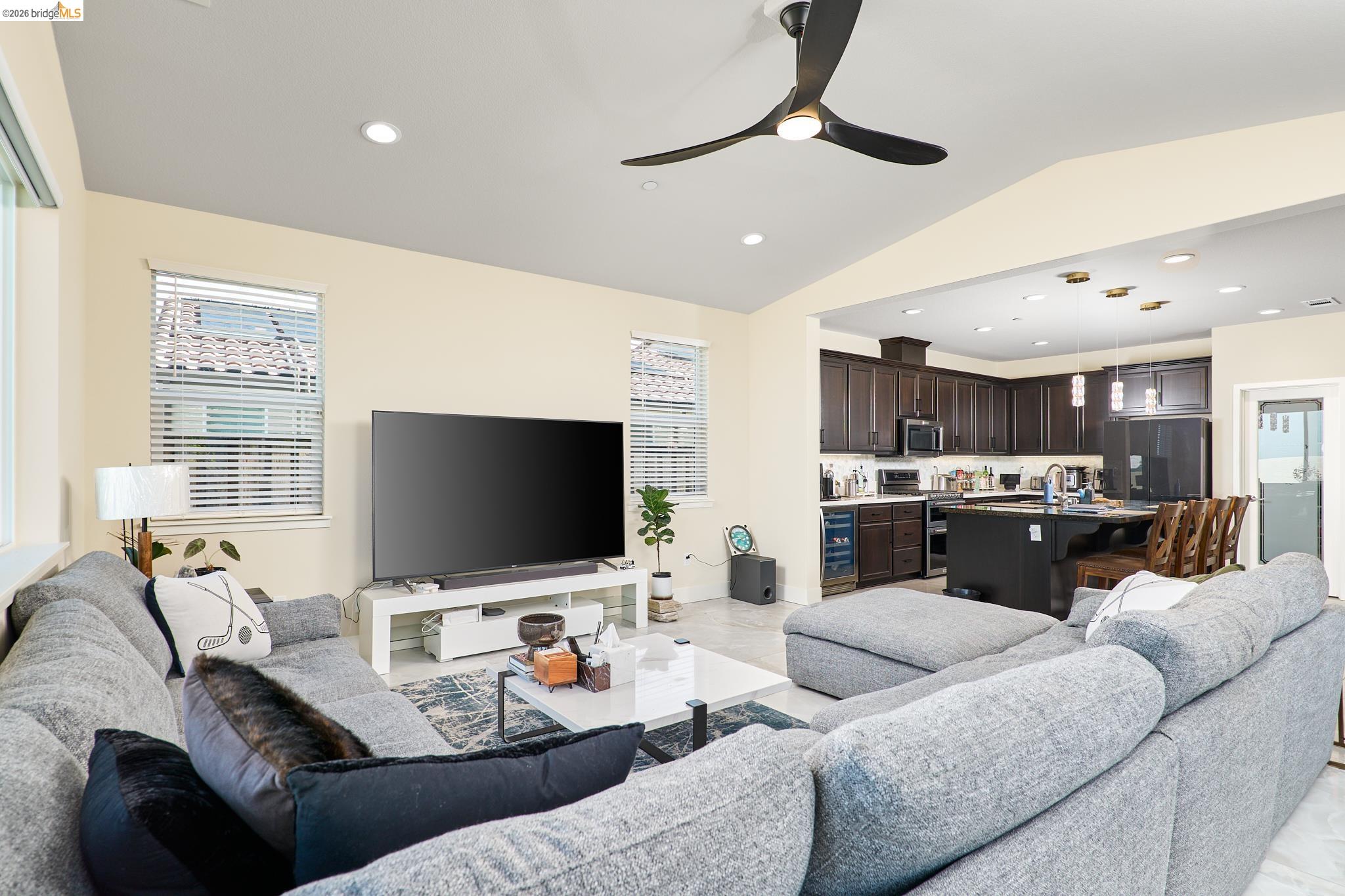 5532 Promontory Way Antioch, CA 94531 - Photo 11 of 45 Living room with a ceiling fan, recessed lighting, vaulted ceiling, and beverage cooler