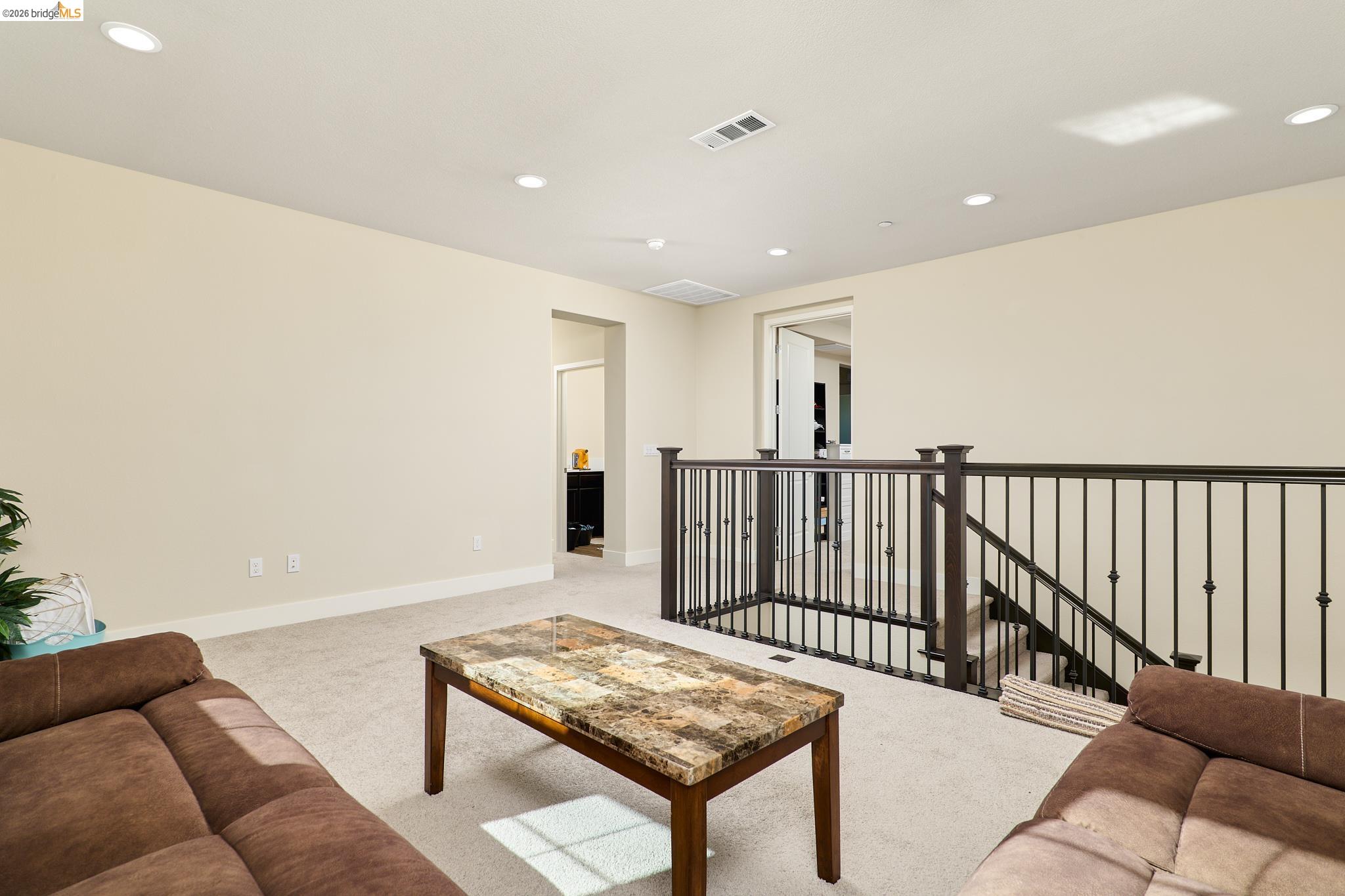 5532 Promontory Way Antioch, CA 94531 - Photo 14 of 45 Living room with light colored carpet and recessed lighting