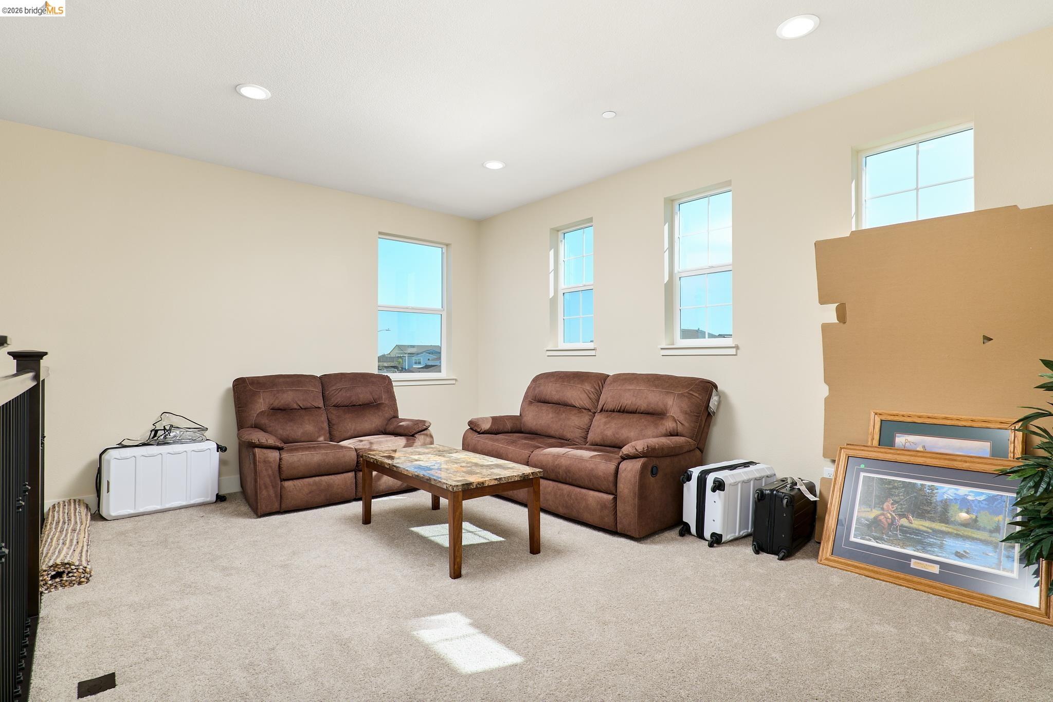 5532 Promontory Way Antioch, CA 94531 - Photo 15 of 45 Living area featuring light colored carpet and recessed lighting