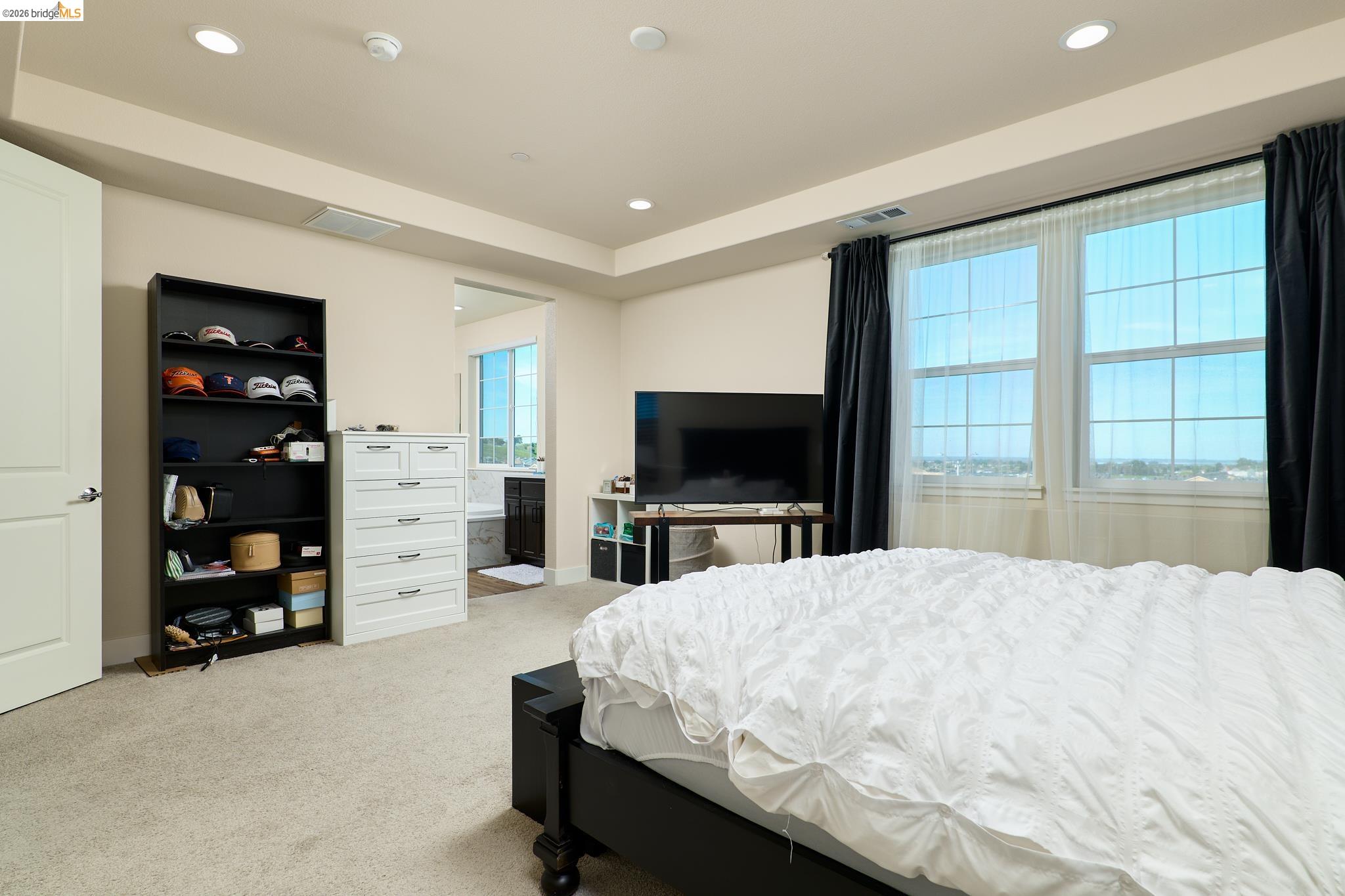 5532 Promontory Way Antioch, CA 94531 - Photo 18 of 45 Bedroom with light colored carpet, recessed lighting, and connected bathroom