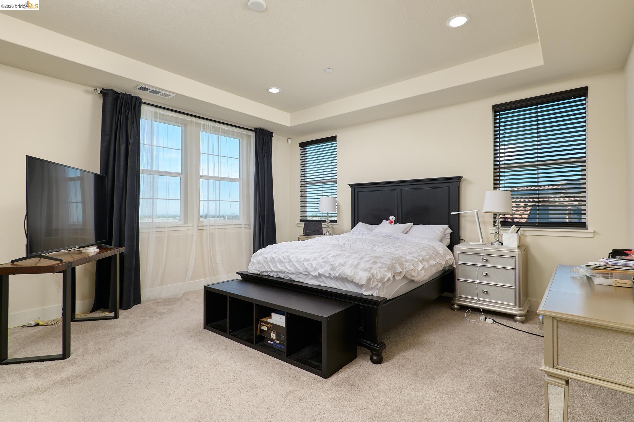 5532 Promontory Way Antioch, CA 94531 - Photo 19 of 45 Bedroom featuring light carpet, a tray ceiling, and recessed lighting