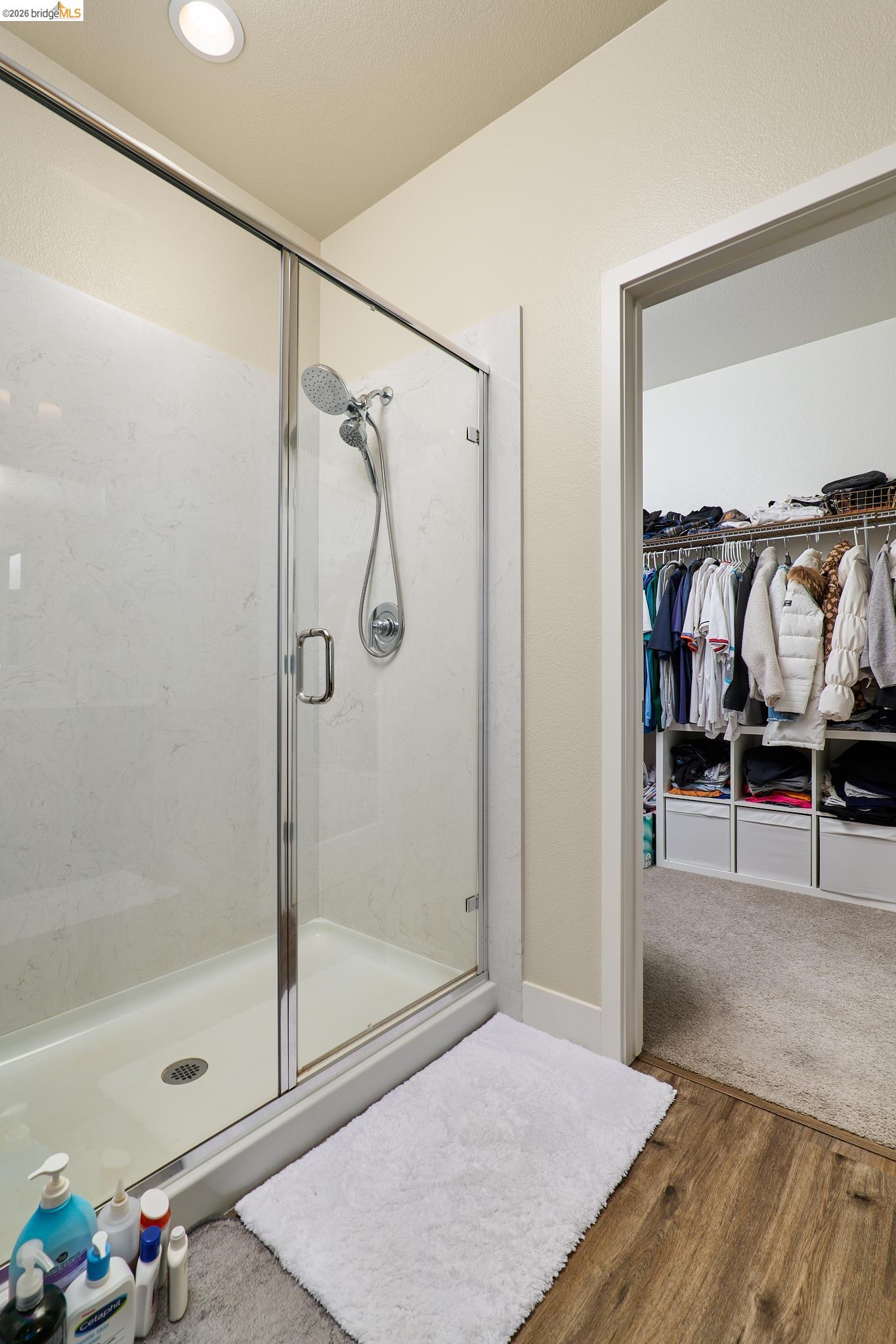 5532 Promontory Way Antioch, CA 94531 - Photo 25 of 45 Full bath featuring a walk in closet, wood finished floors, a shower stall, and recessed lighting