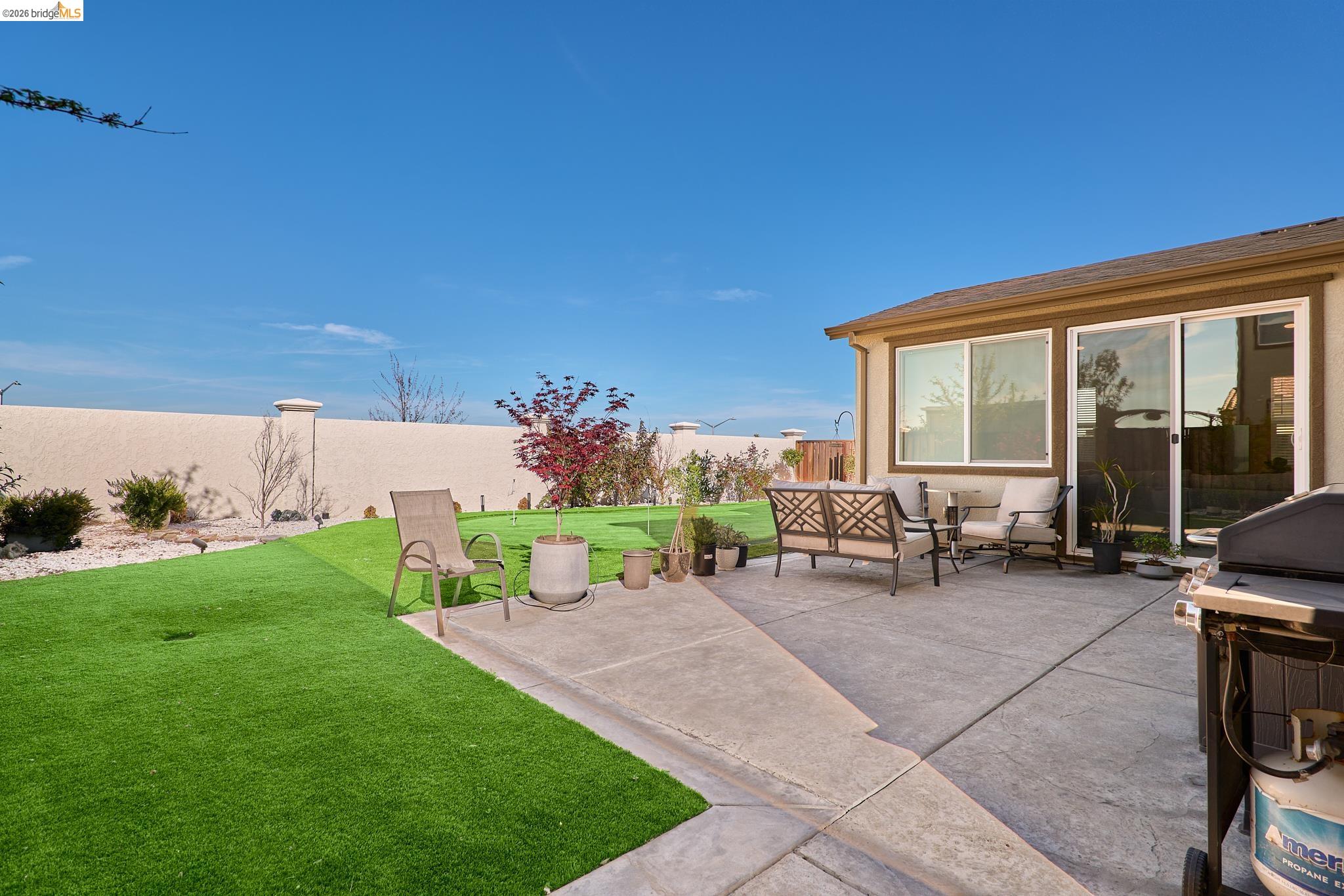 5532 Promontory Way Antioch, CA 94531 - Photo 37 of 45 Fenced backyard featuring an outdoor hangout area, a grill, and a patio area