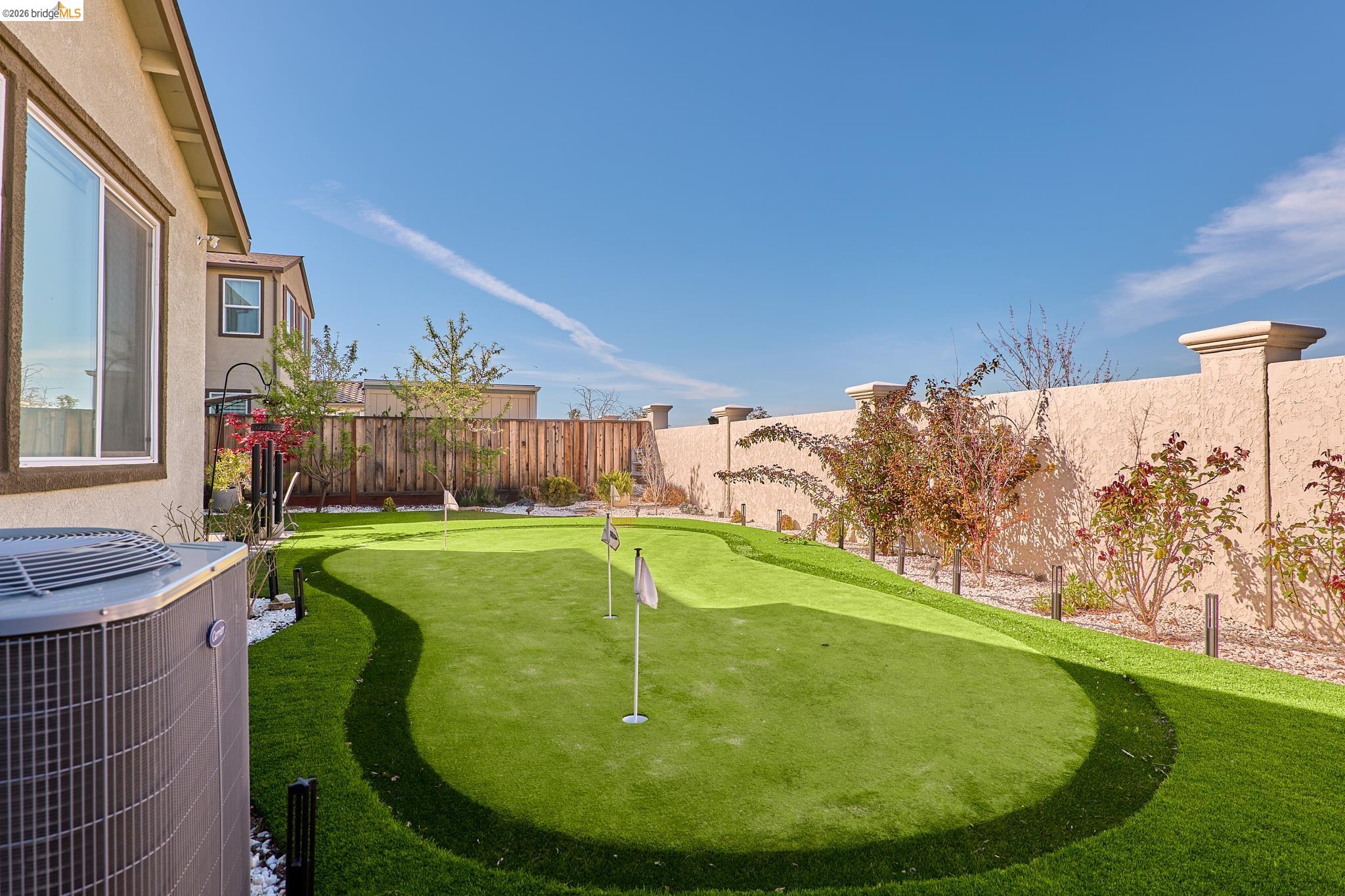 5532 Promontory Way Antioch, CA 94531 - Photo 39 of 45 Fenced backyard featuring a putting green and a patio