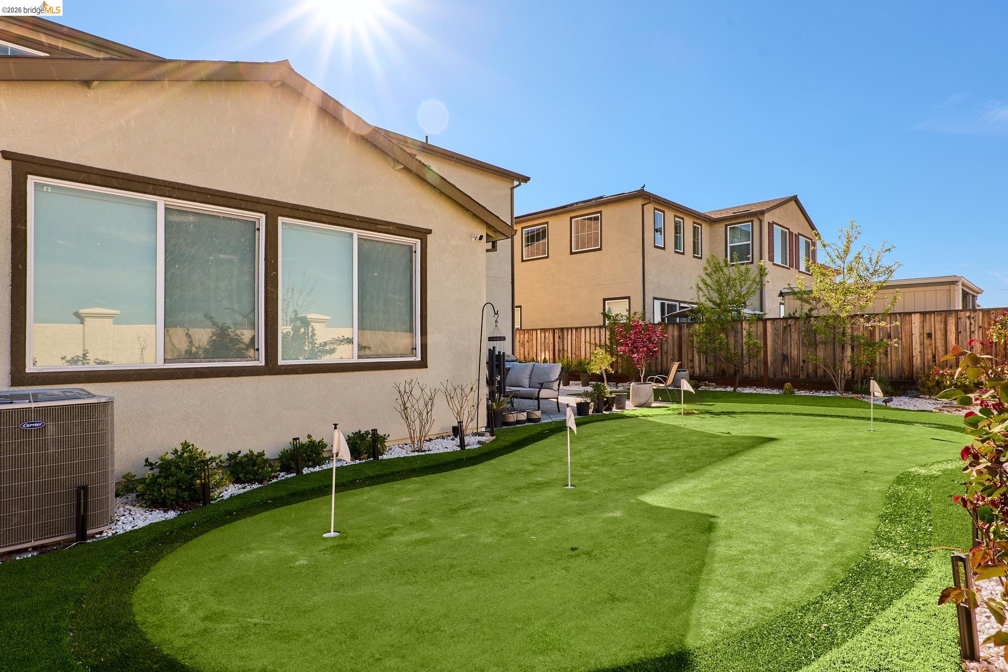 5532 Promontory Way Antioch, CA 94531 - Photo 40 of 45 Fenced yard featuring a putting area and an outdoor living space