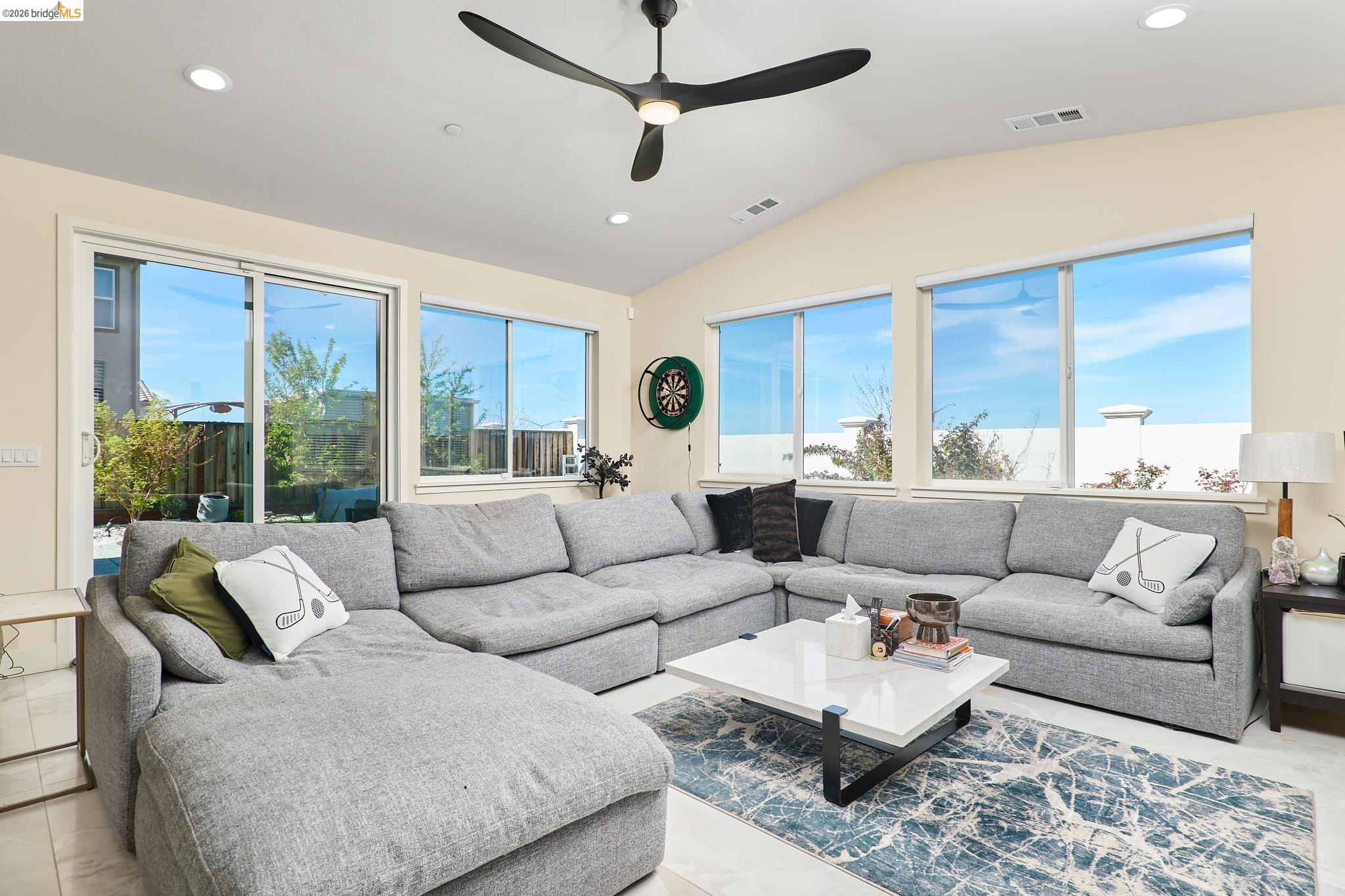 5532 Promontory Way Antioch, CA 94531 - Photo 10 of 45 Living room featuring plenty of natural light, recessed lighting, ceiling fan, and vaulted ceiling