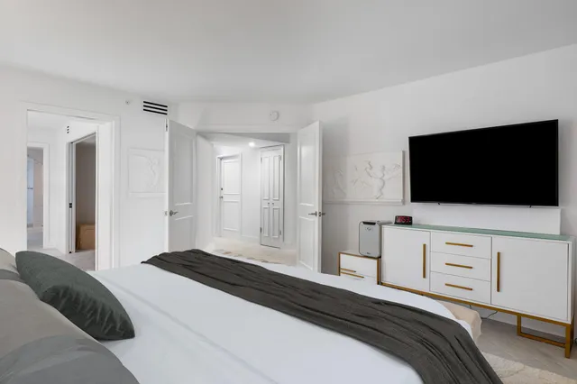 a bathroom with a bathtub and shower