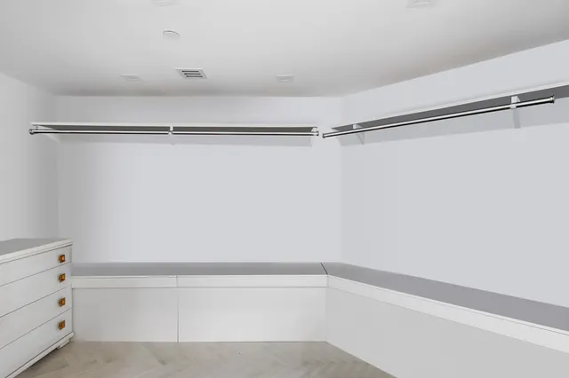 a bathroom with a sink toilet a mirror and shower