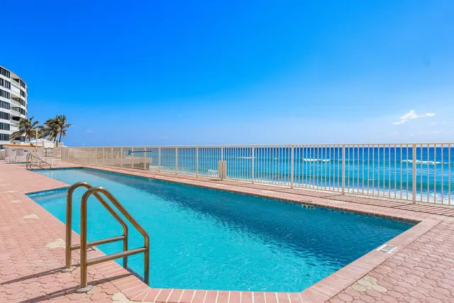 a view of swimming pool from a balcony