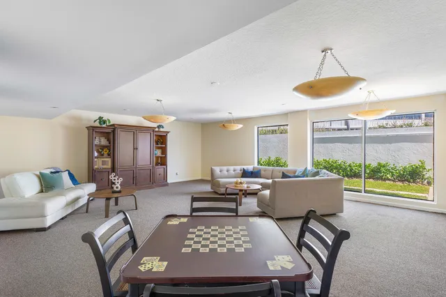 a living room with furniture and a table
