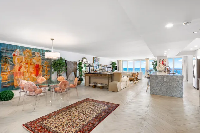 a living room with furniture and a rug