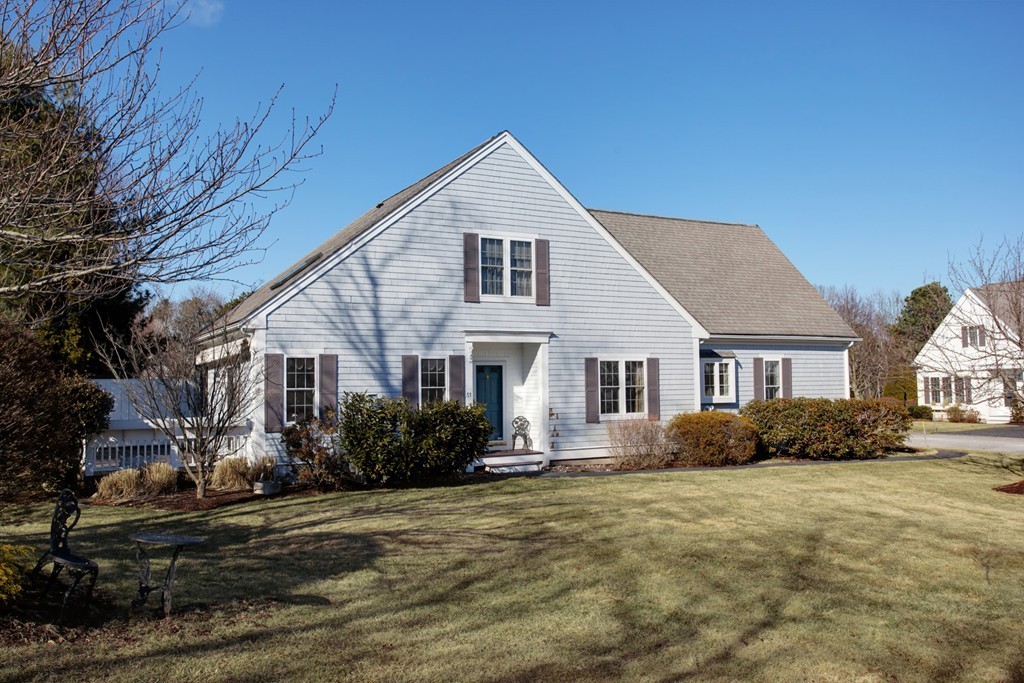 51 Stratford Ridge, Unit 152 Mashpee, MA 02649 - Photo 3 of 28 a front view of a house with a yard