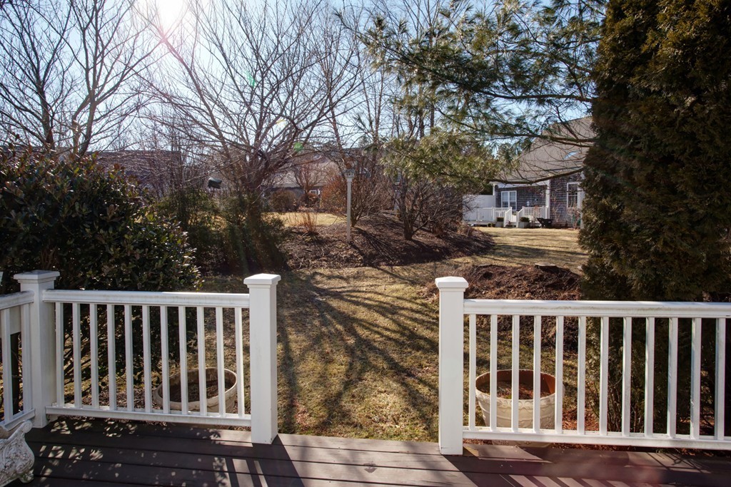 51 Stratford Ridge, Unit 152 Mashpee, MA 02649 - Photo 6 of 28 a view of a wooden fence
