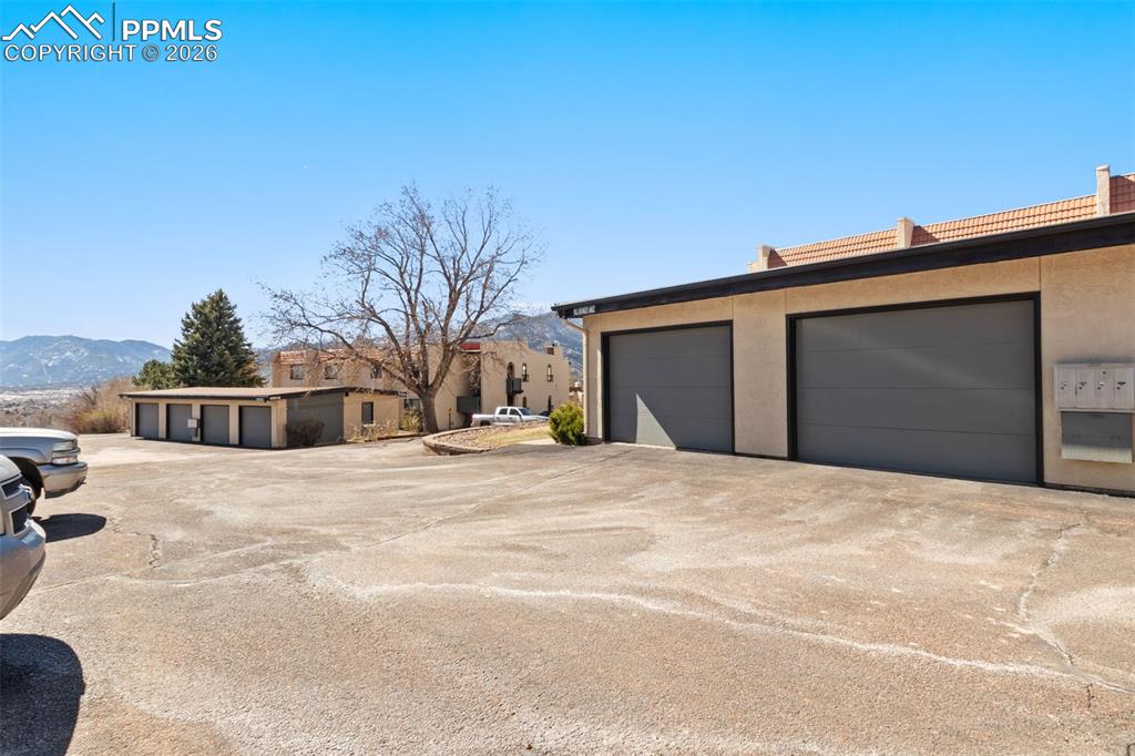 1142 Fontmore Road, Unit C Colorado Springs, CO 80904 - Photo 44 of 47 Garage measures 27 ft deep by 11.5 ft wide, with built-in overhead storage