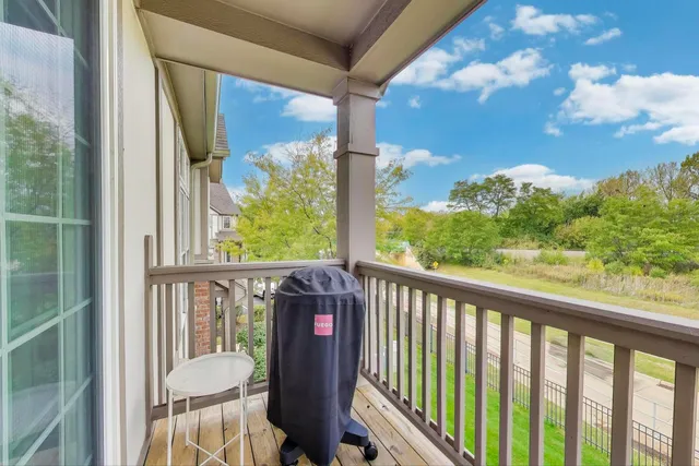 a view of a balcony with chair