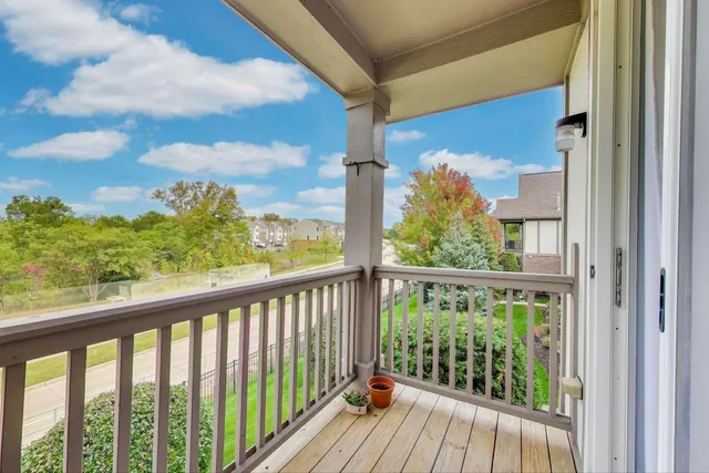 a view of a balcony with wooden floor
