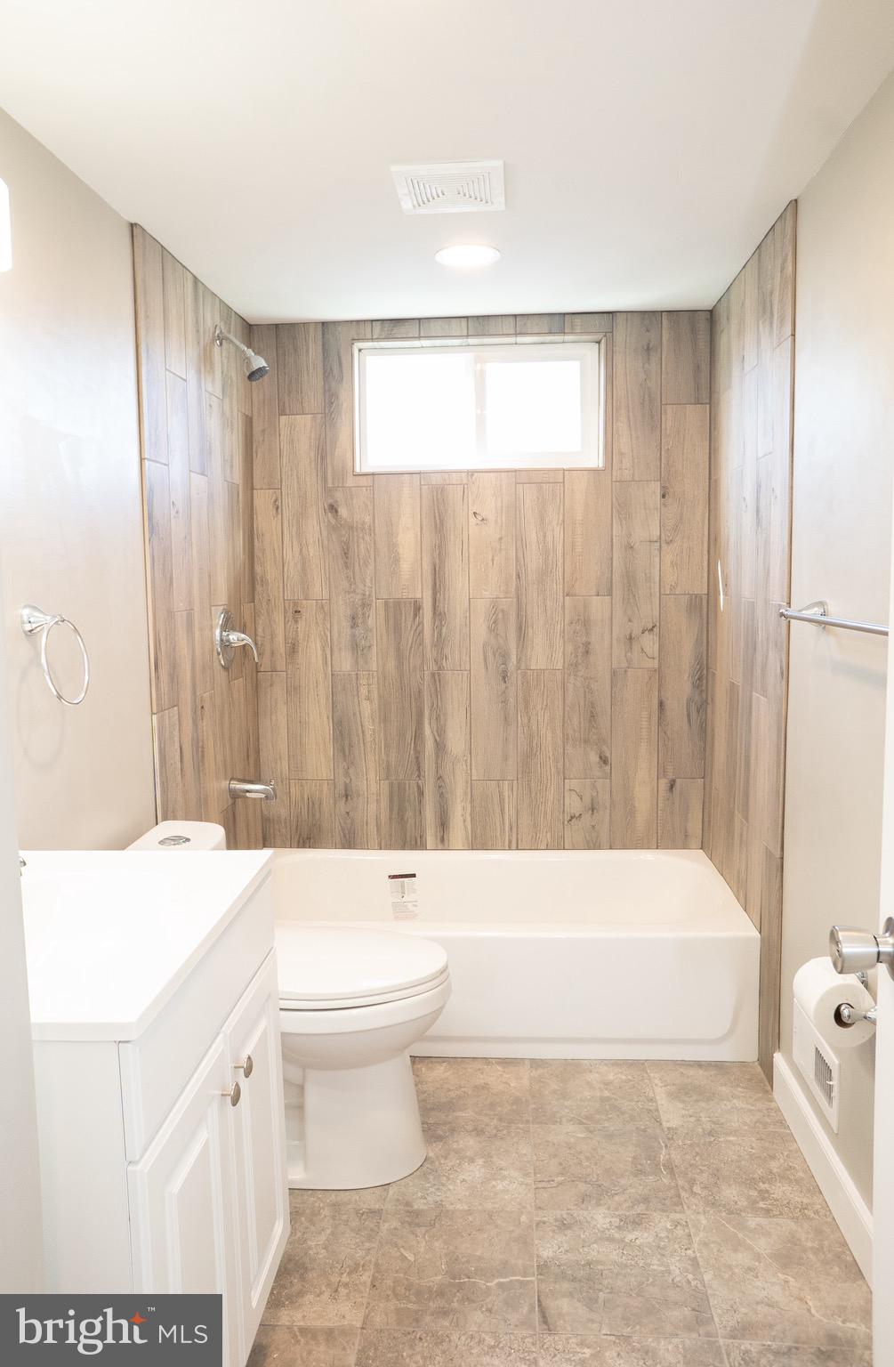 915 Martin Road Baltimore, MD 21221 - Photo 14 of 34 Second Full Bath w/Ceramic Wood Tile Surround