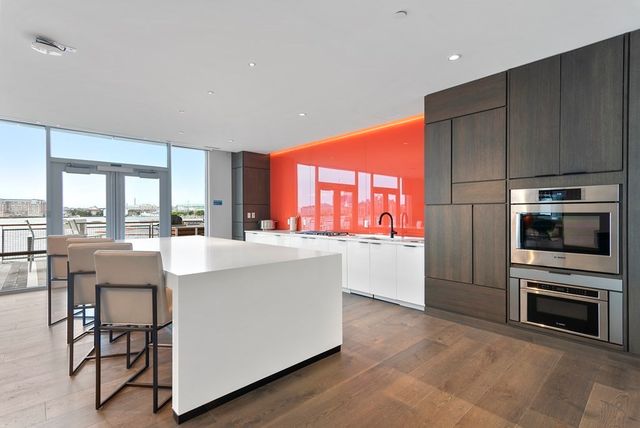 a view of roof deck with seating space and barbeque oven