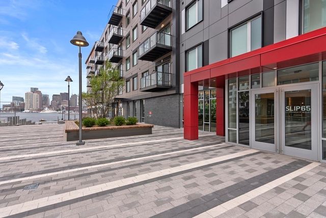 a view of a lake with tall buildings