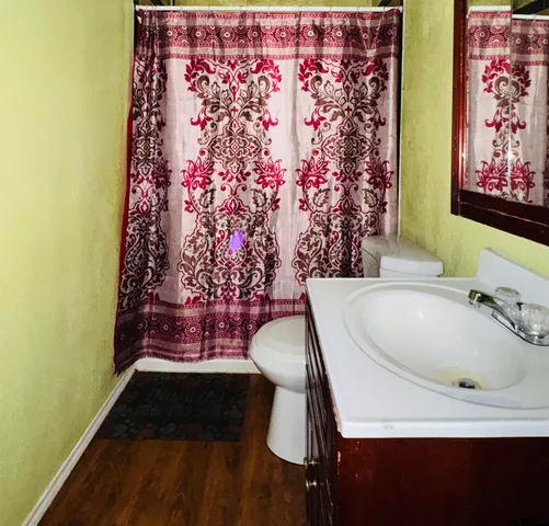 a bathroom with a bathtub and a shower curtain