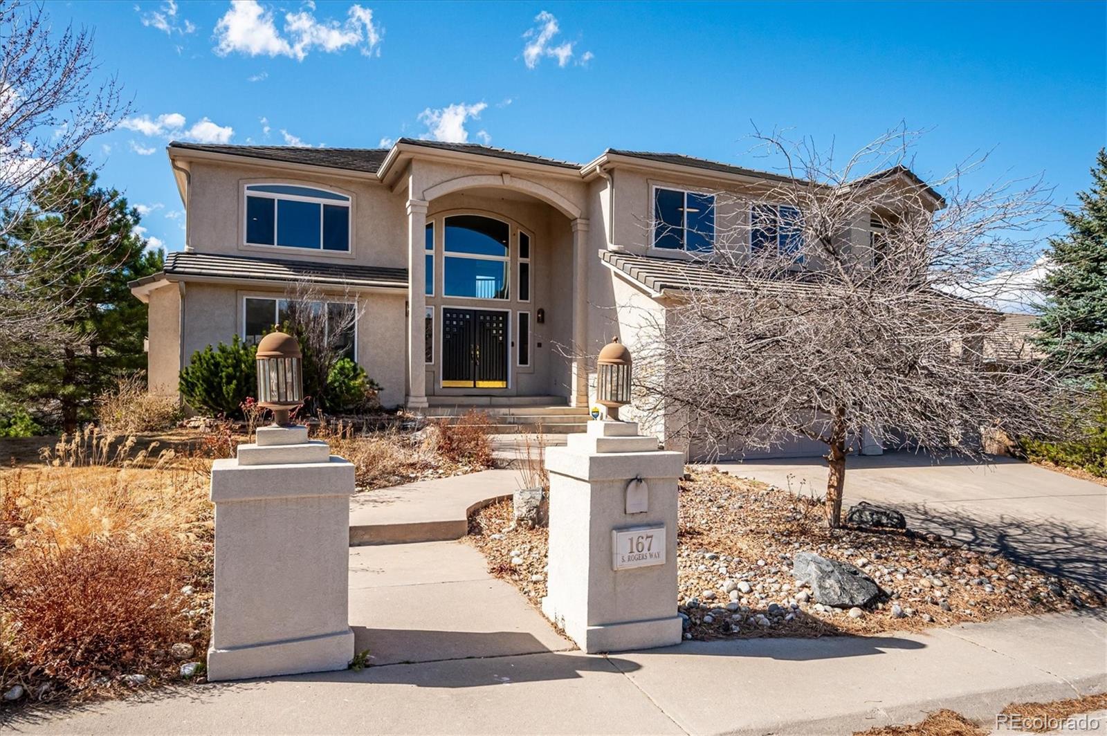 167 South Rogers Way Golden, CO 80401 - Photo 1 of 50 a front view of a house with garden