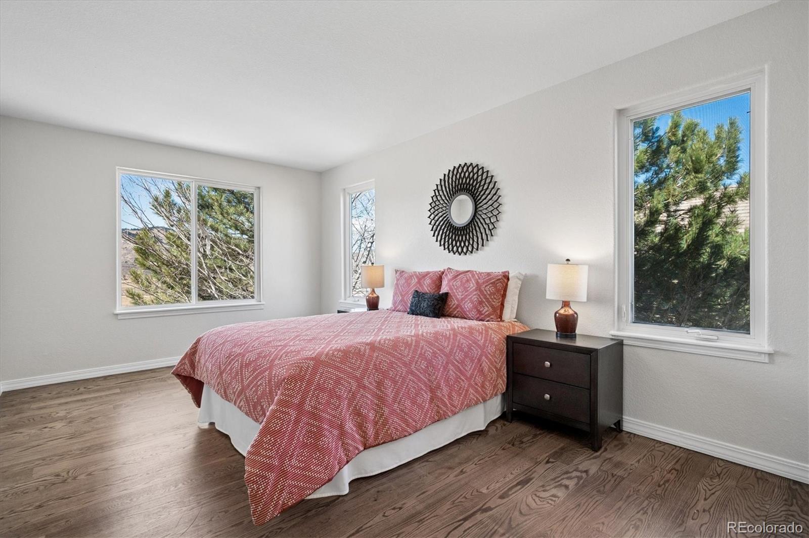 167 South Rogers Way Golden, CO 80401 - Photo 19 of 50 a bedroom with a bed and a window