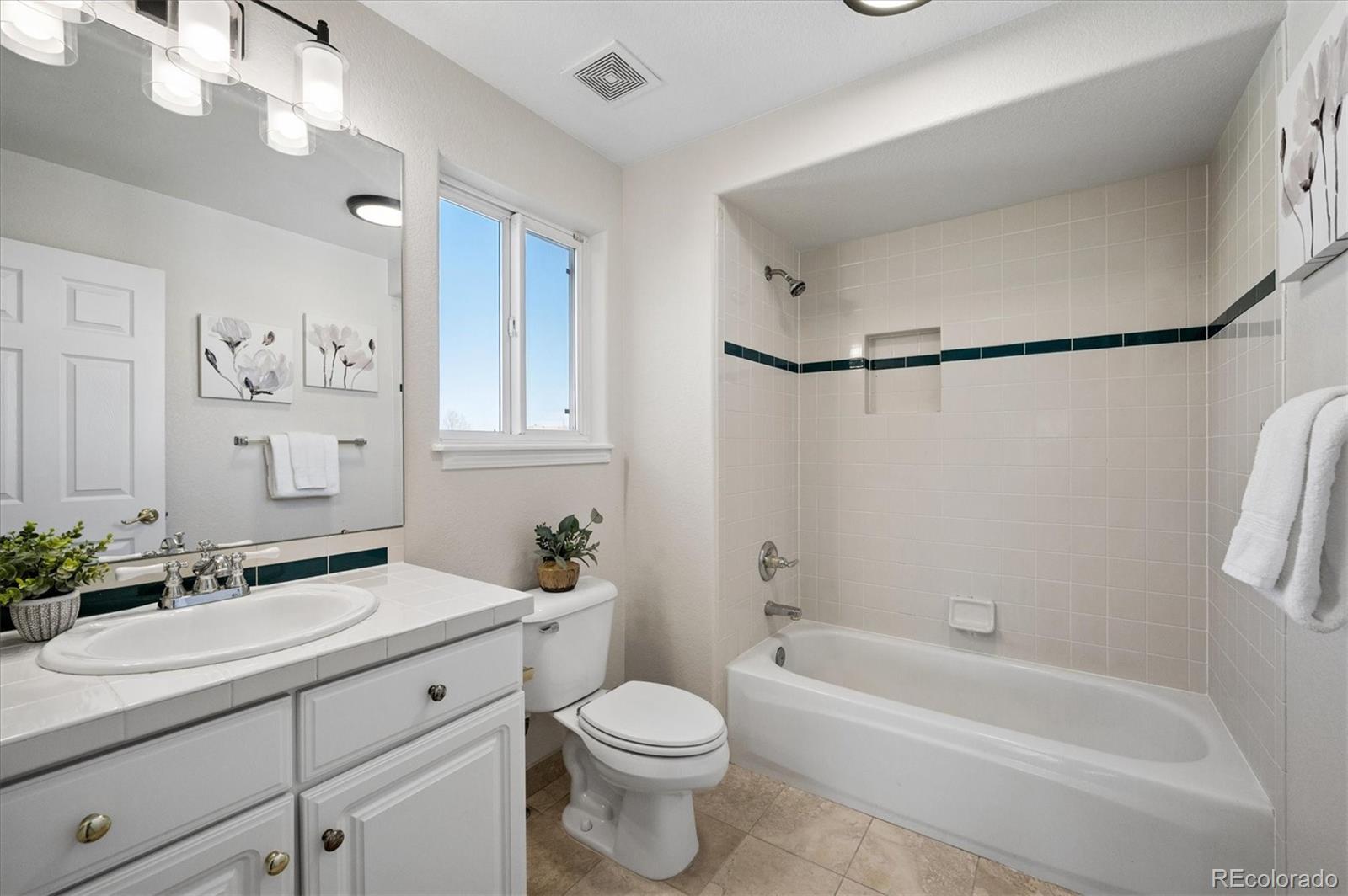 167 South Rogers Way Golden, CO 80401 - Photo 20 of 50 a bathroom with a sink a toilet and bathtub