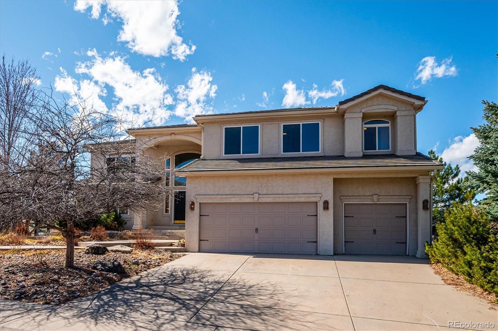 167 South Rogers Way Golden, CO 80401 - Photo 2 of 50 a front view of a house with yard