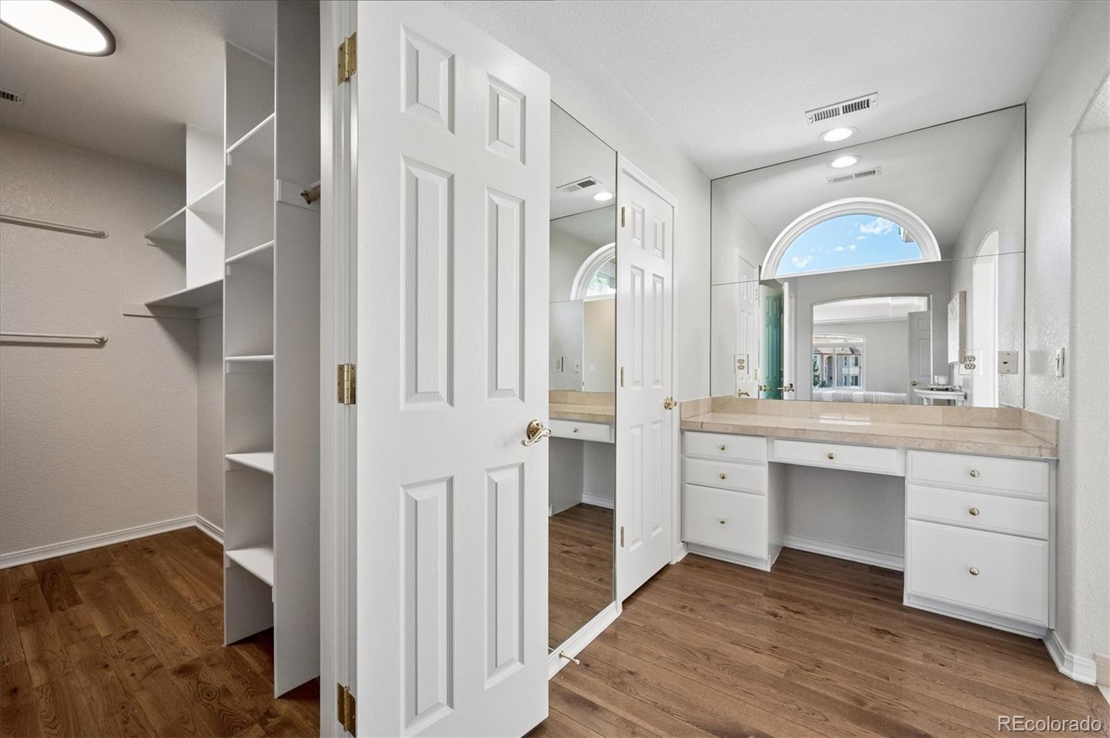 167 South Rogers Way Golden, CO 80401 - Photo 25 of 50 a spacious bathroom with a double vanity sink and a mirror