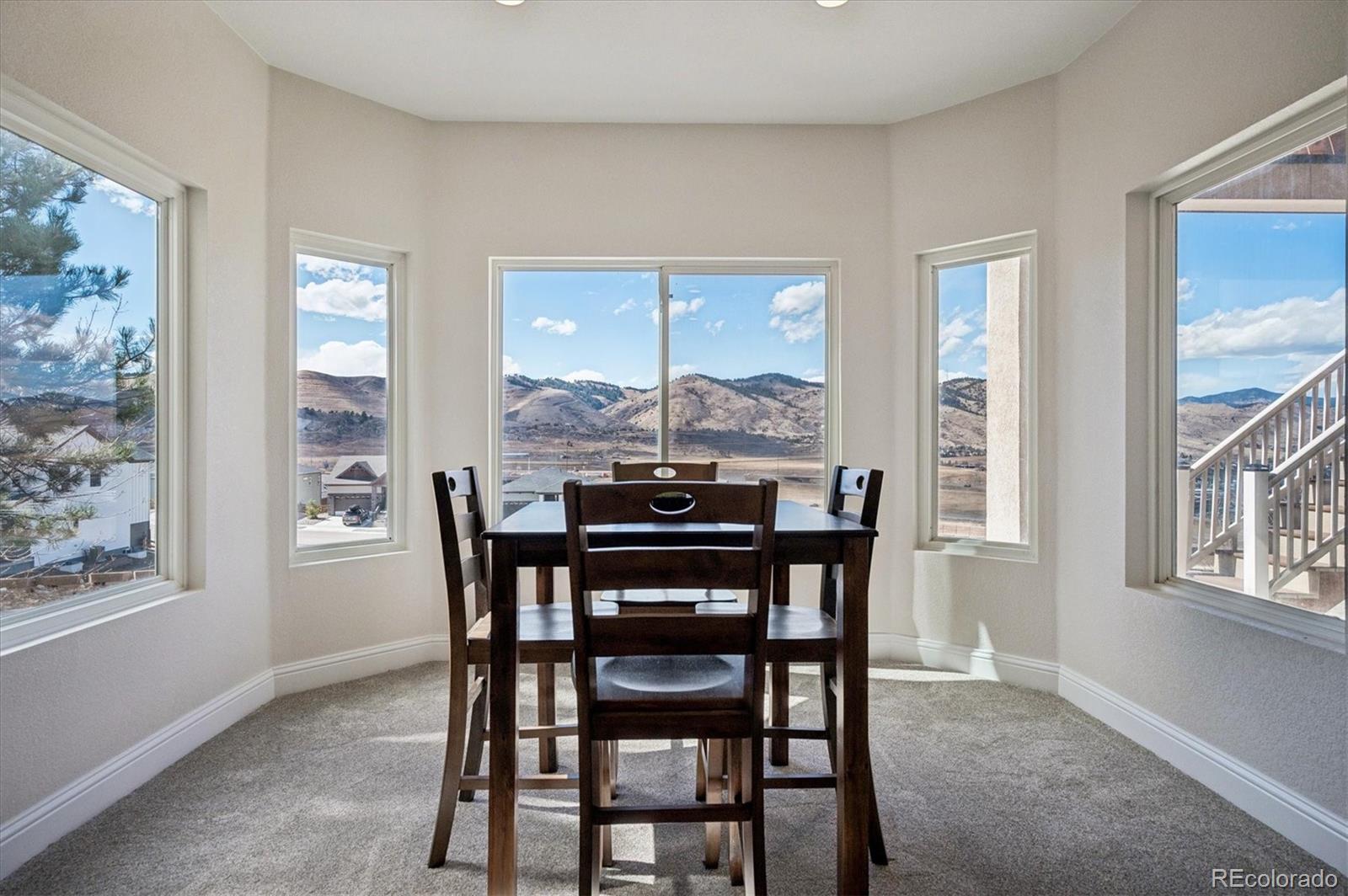 167 South Rogers Way Golden, CO 80401 - Photo 39 of 50 a dining room with furniture and window