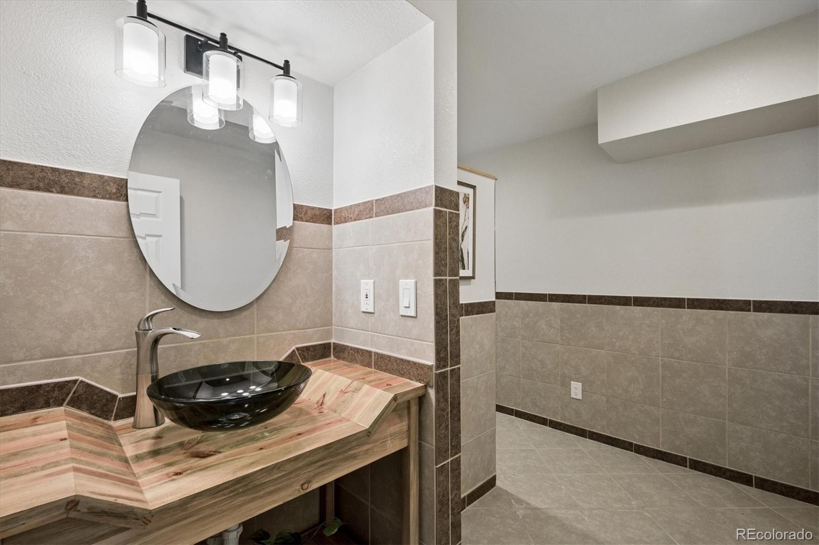 167 South Rogers Way Golden, CO 80401 - Photo 42 of 50 a bathroom with a sink and a mirror